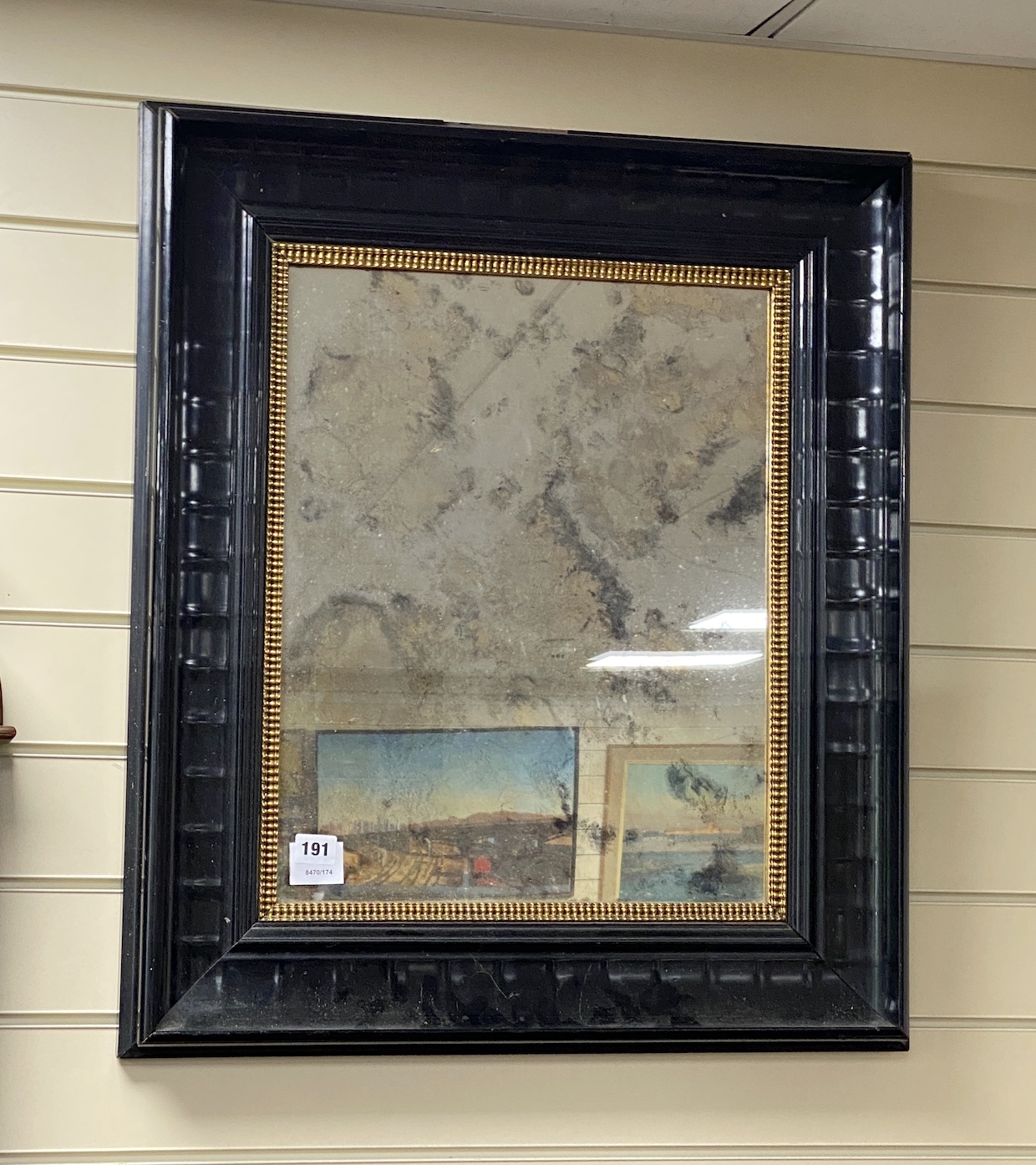 A Victorian style rectangular ebonized framed wall mirror, with gilt slip, width 62cms, height 72cms.